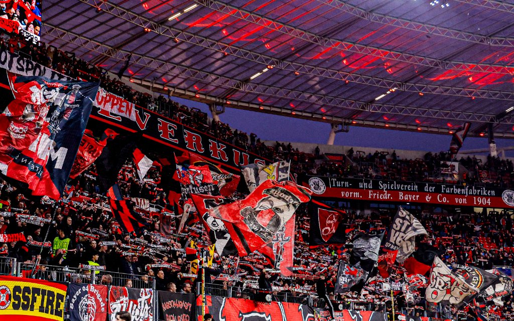 UEFA Champions League 2025/26 Round of 16 First Leg - Bayer 04 Leverkusen vs Arsenal FC, Germany Fans and Supporters of Bayer 04 Leverkusen showing their scarves and waving flags prior to the UEFA Champions League 2025/26 Round of 16 First Leg match between Bayer 04 Leverkusen and Arsenal FC at BayArena on March 11, 2026 in Leverkusen, Germany.