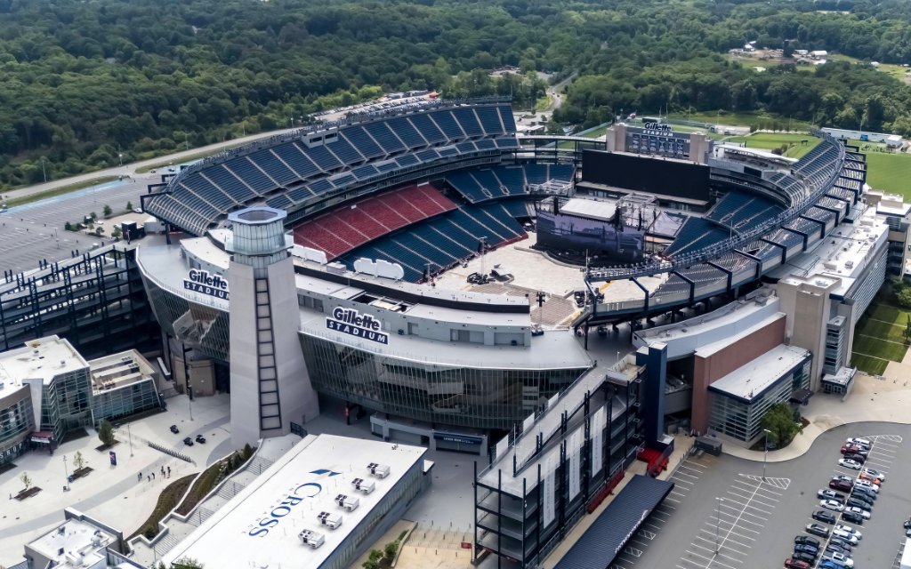 Iconic Aerial View: Gillette Stadium, New England s Premier Sports and Events Hub Gillette Stadium, home to the Patriots and Revolution, sprawls in Foxborough, MA, serving sports and events with a capacity of 64,628, opened in 2002